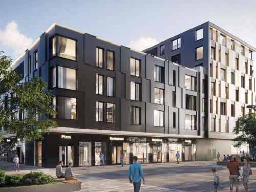 un edificio negro con gente caminando delante de él en Novotel Tallinn, en Tallin