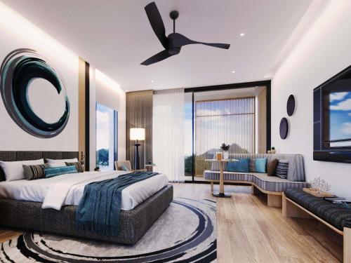 une chambre avec un grand lit et un canapé dans l'établissement MontAzure Resort Phuket - MGallery Collection, à Phuket