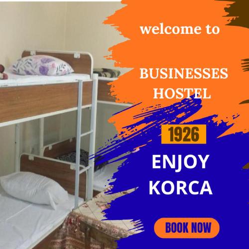 En eller flere senge i et værelse på Business Hostel