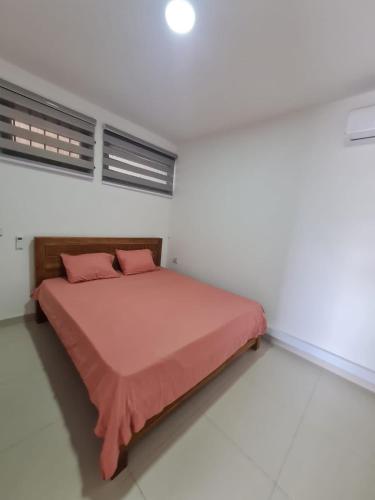 Postel nebo postele na pokoji v ubytování Arc en ciel 2