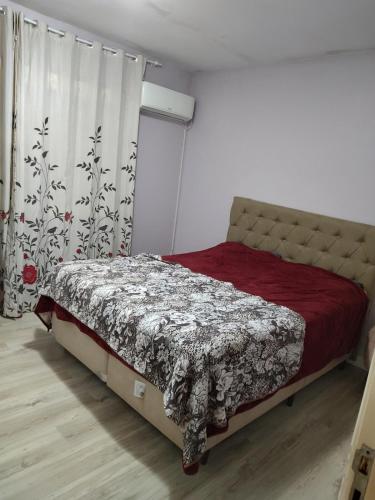 Una cama o camas en una habitación de Bento Gonçalves Bairro Progresso Casa ampla 3 quartos