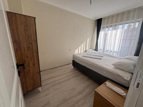 Postel nebo postele na pokoji v ubytování Bolu Tabaklar suit