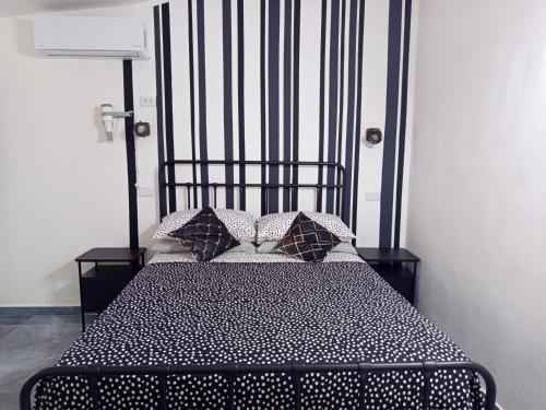 Ένα ή περισσότερα κρεβάτια σε δωμάτιο στο Italiana Hogares