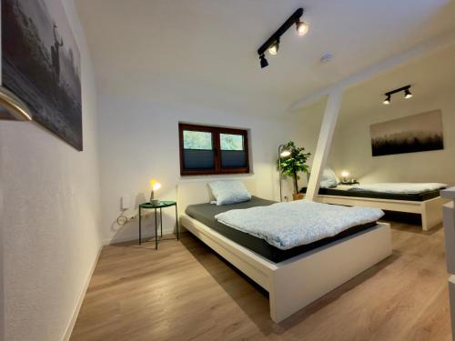 Postel nebo postele na pokoji v ubytování Ferien im Schwarzwald Dörlinbach II