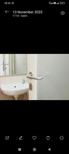 a picture of a bathroom with a sink and a mirror at Easy staycation in Rampal