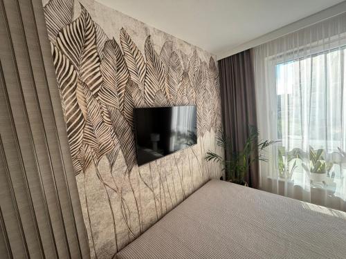 Televiisor ja/või meelelahutuskeskus majutusasutuses Classic&Modern Suite