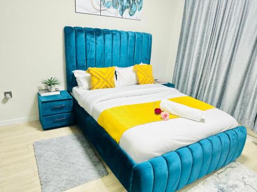 Ένα ή περισσότερα κρεβάτια σε δωμάτιο στο Urban Homes-Two Bedroom Near JKIA Airport