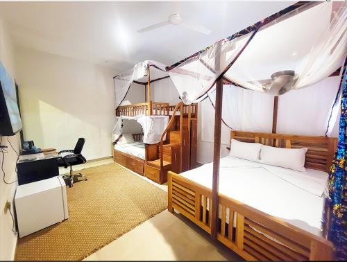 Ένα ή περισσότερα κρεβάτια σε δωμάτιο στο Sand and Sunset