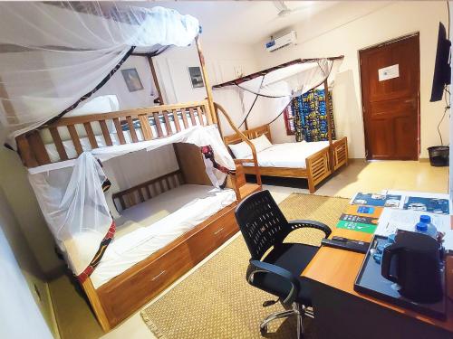 Ένα ή περισσότερα κρεβάτια σε δωμάτιο στο Sand and Sunset