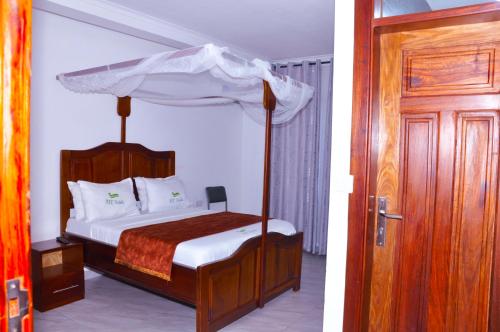 Ένα ή περισσότερα κρεβάτια σε δωμάτιο στο KCC Hotel