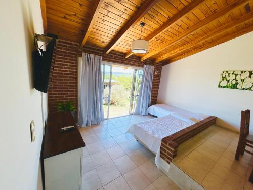 Ένα ή περισσότερα κρεβάτια σε δωμάτιο στο Complejo Acanto