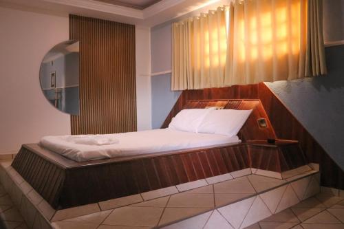 Ένα ή περισσότερα κρεβάτια σε δωμάτιο στο Johnnys motel