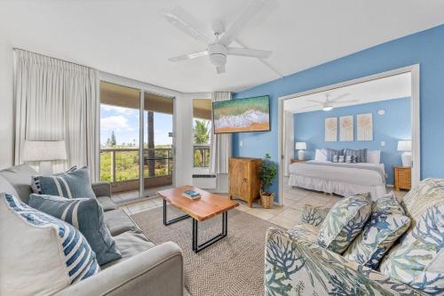 a living room with a couch and a bed at Maui Banyan P301 · MB P301 Remodeled 2BD Condo Across Beach Pool in Wailea
