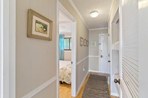 a hallway with a door leading to a bedroom at SC206A: 206A Sea Cabin in Isle of Palms