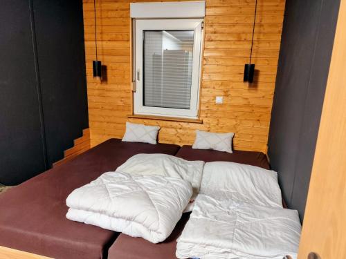 Ένα ή περισσότερα κρεβάτια σε δωμάτιο στο Tiny House