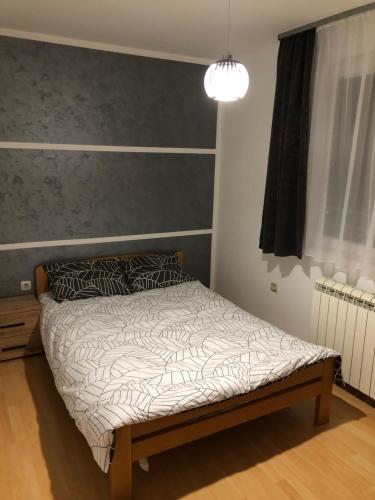Postel nebo postele na pokoji v ubytování Apartman Lav