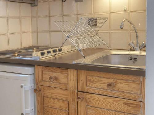 a small kitchen with a sink and a stove at Studio cosy 2/3 pers au cœur de Briançon, proche centre-ville et télécabine - FR-1-330C-42 in Briançon