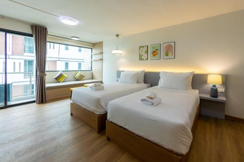 Ένα ή περισσότερα κρεβάτια σε δωμάτιο στο Chorbnorn Hotel