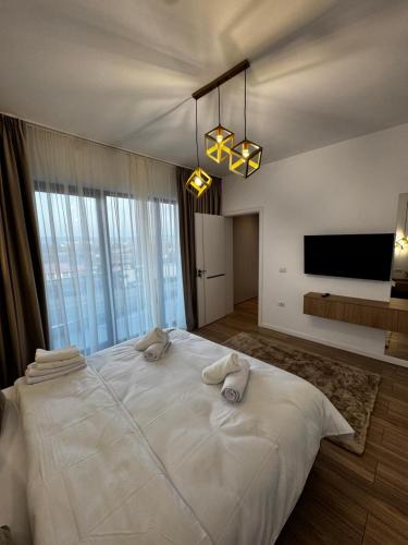 Ένα ή περισσότερα κρεβάτια σε δωμάτιο στο District Deluxe