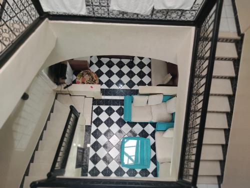 a doll house with a staircase and a living room at JackRouivo in Marrakech