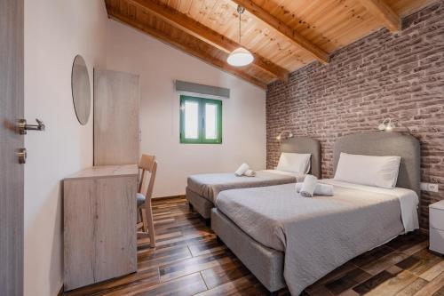 Giường trong phòng chung tại Villa Elia