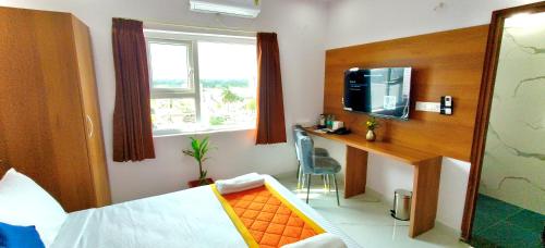 Ένα ή περισσότερα κρεβάτια σε δωμάτιο στο Keerthis Comforts - Airport pick up or Drop INR 449