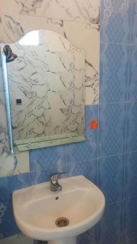 a bathroom with a sink and a mirror at sweet area in Mirleft