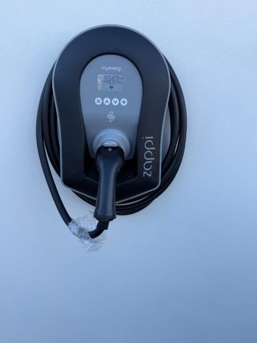 a close up of a car plugged into a car charger at The Gallery in Lancing