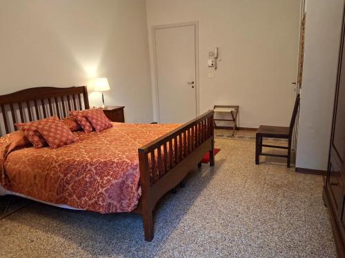 a bedroom with a bed and a table and a chair at Hotel Tourist House in Florence