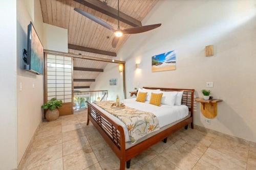 a bedroom with a large bed in a room at Kulakane 310 · KK 310 Updated BeachFront 2BD w AC Pool in Kahana