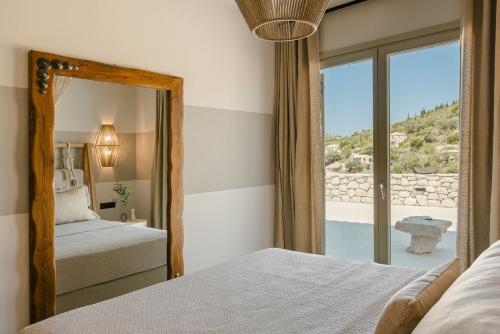 Postel nebo postele na pokoji v ubytování Assos Riverie