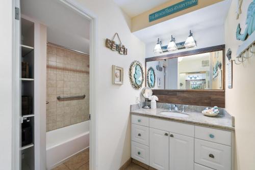 a bathroom with a sink and a mirror at Lahaina Shores 428 · LS 428 Dream Vacation Studio by the Beach a in Lahaina