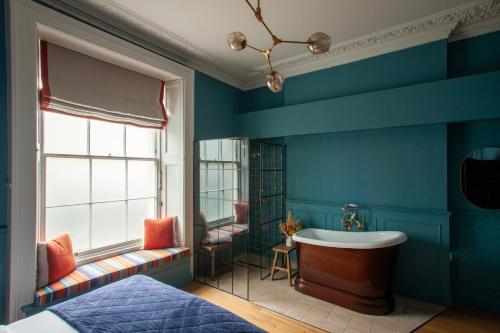 Ένα ή περισσότερα κρεβάτια σε δωμάτιο στο Lido Townhouse