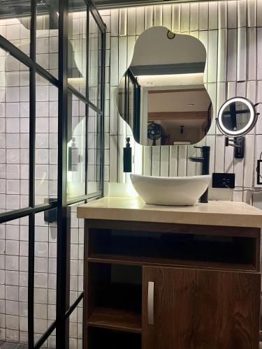 a bathroom with a sink and a mirror at Casa Ebano 967 in Cartagena de Indias