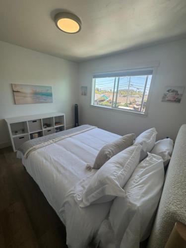 Ένα ή περισσότερα κρεβάτια σε δωμάτιο στο 2 Bedroom Pleasure Point Getaway