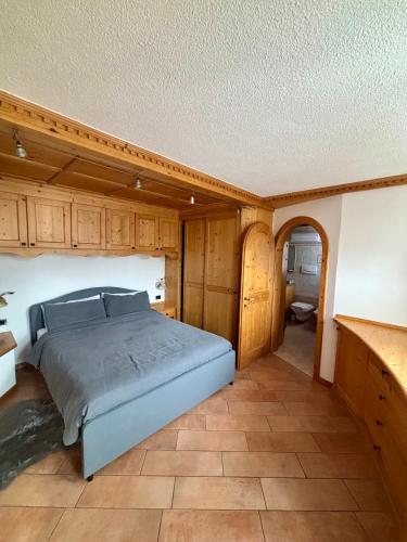 Ένα ή περισσότερα κρεβάτια σε δωμάτιο στο Pragma Apartments - Dolomiti by Valentina