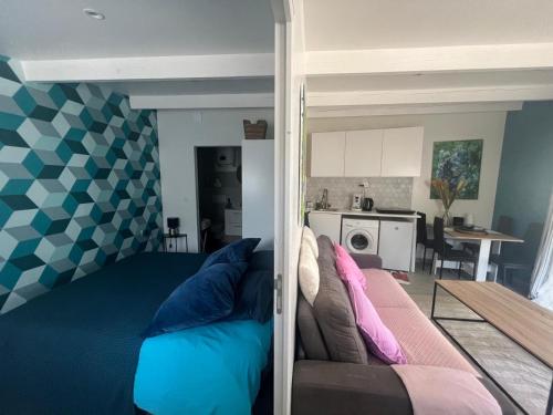 a bedroom with a couch and a living room at Maison Marseille Jacuzzi, jardin, parking in Marseille