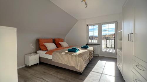 Ένα ή περισσότερα κρεβάτια σε δωμάτιο στο Ferienhaus Hörnchen