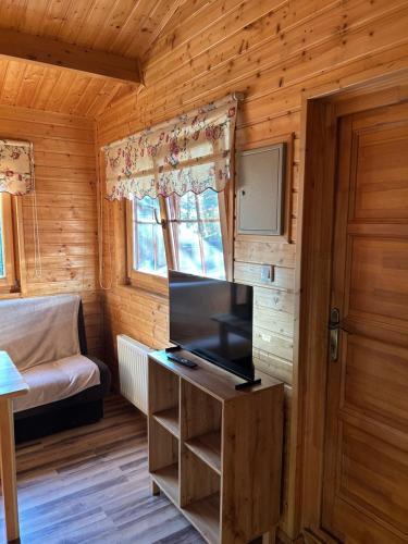 Ένα ή περισσότερα κρεβάτια σε δωμάτιο στο Domki caloroczne Hotel Zagiel