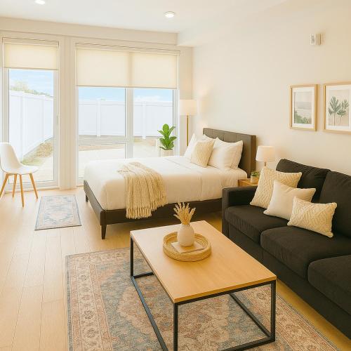 a living room with a bed and a couch at Luxury Stay for NYC visit Jersey City 7 Min Walk NYC Train Station in Jersey City