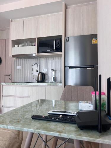 Køkken eller tekøkken på City Garden Olympus condo with balcony washing machine