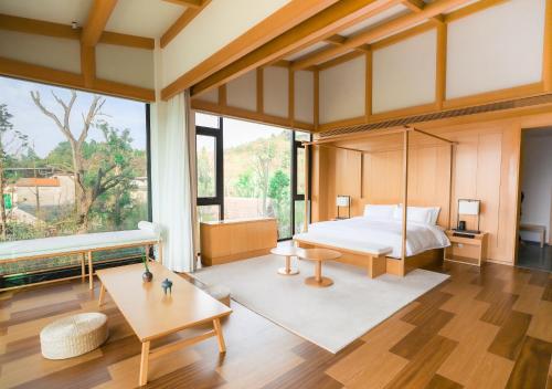 Una cama o camas en una habitación de 成都释玥森林酒店