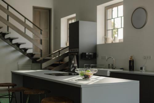 a kitchen with a counter with a bowl on it at LOFT Köveskál in Köveskál