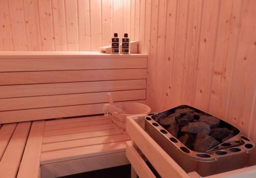 a sauna with a hot tub in the middle at Ferienhaus Bella Vista in Presseggersee