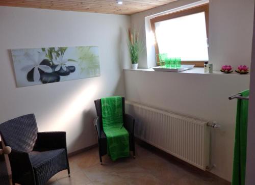 a waiting room with two chairs and a window at Ferienhaus Bella Vista in Presseggersee