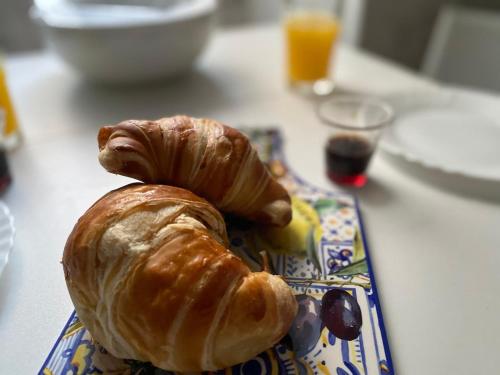 two croissants on a plate on a table at Morgera N8 in Forio d'Ischia