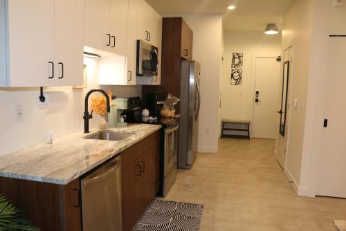 a kitchen with a sink and a counter top at Downtown Detroit Studio Apt in Detroit