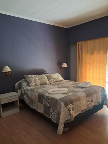 En eller flere senge i et værelse på Casa Quinta Las Palmeras