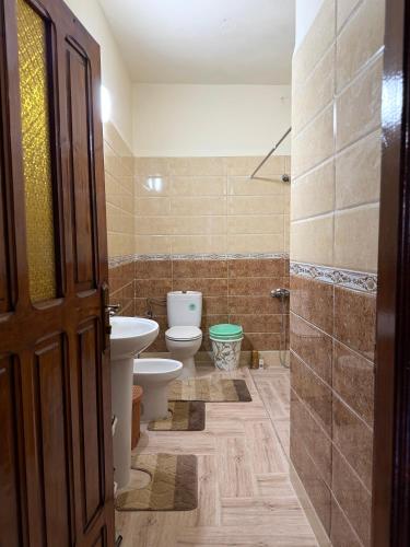 a bathroom with a toilet and a sink at Samadis Home in Larache