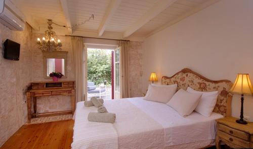 Ένα ή περισσότερα κρεβάτια σε δωμάτιο στο Villa Aurora